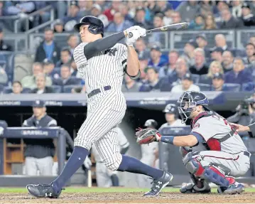  ?? AFP ?? Aaron Judge of the New York Yankees hits a two-run home run against Jose Berrios of the Minnesota Twins during the fourth inning.