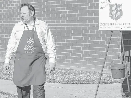  ?? Bobby Ross Jr. photos ?? Bruce Bachman, an engineer living in the Dallas-Fort Worth area, gives a little of his time during the holiday season as a volunteer bell ringer for the Salvation Army.