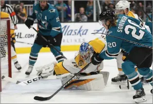  ?? NHAT V. MEYER — STAFF PHOTOGRAPH­ER ?? The Sharks’ Marcus Sorensen scores the first goal of the game against the Predators’ Juuse Saros. The Sharks scored three times in the first period of Tuesday’s win at SAP Center.