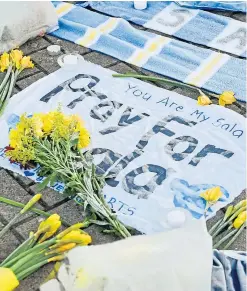  ?? Picture: PA. ?? Tributes left outside Cardiff City’s stadium.