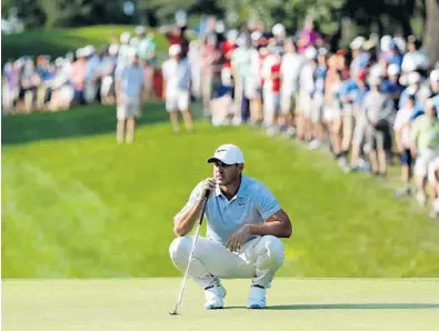  ?? JEFF ROBERSON/AP ?? Brooks Koepka waits to putt on the 15th green during the third round of the PGA Championsh­ip. He shot a 4-under 66 to set up a two-stroke lead heading into the final round at Bellerive Country Club.