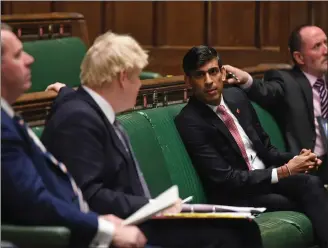  ??  ?? Prime Minister Boris Johnson speaking to Chancellor of the Exchequer Rishi Sunak in the Commons