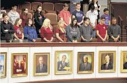  ?? SUSAN STOCKER/STAFF FILE PHOTO ?? Marjory Stoneman Douglas students stand in the guest gallery of the Senate chamber in Tallahasse­e on Feb. 21 during a tribute to the victims of the mass shooting at Marjory Stoneman Douglas High.