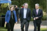  ?? JONATHAN CROSBY — THE ASSOCIATED PRESS ?? From left, Esther George, President and CEO of the Federal Reserve Bank of Kansas City, John Williams, President and CEO of the Federal Reserve Bank of New York, and Jerome Powell, Chairman of the Board of Governors of the Federal Reserve System walk together after Powell’s speech at the Jackson Hole Economic Policy Symposium on Friday in Jackson Hole, Wyo.