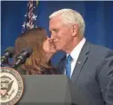  ??  ?? Vice President Mike Pence is kissed by his wife, Karen, on Jan. 18.