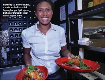  ??  ?? Plated up … service with a smile at the Black Bull Tapas Bar and Grill where PNG chef Daniel Brehaut is making his mark.