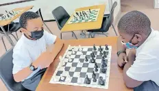  ?? Supplied ?? BROWN’S School pupils play a game of chess.
|