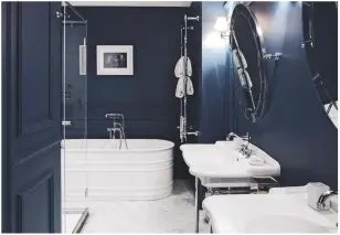  ??  ?? Project details Twin basins and mirrors, designed by architect Antonio girardi for Rome’s Palazzo dama, shine out against an inky backdrop. This is Patricia Urquiola’s Vieques bath for Agape, from £7,774.50, at West One Bathrooms.