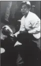  ?? AP file photo ?? Hotel busboy Juan Romero goes to the aid of U.S. Sen. Robert Kennedy moments after Kennedy was shot June 5, 1968, in the Ambassador Hotel in Los Angeles.