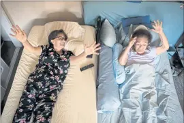  ?? ?? Ana Nicho Luu, 66, left, leads her 90-year-old mother, Maura Nicho, in some simple exercises before the two have dinner in their Santa Clara home.