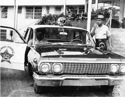  ?? ORANGE COUNTY SHERIFF'S OFFICE ?? Orange County Sheriff ’s deputies Leroy Williams, seated, and Louis Crooms patrolled Orange County in the storied Car 44. Crooms was one of the agency’s first black deputies — hired as a patrol in May of 1963. He died Aug. 7 at 94.