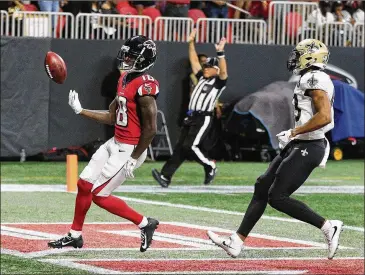  ?? CURTIS COMPTON / CCOMPTON@AJC.COM ?? Atlanta Falcons wide receiver Calvin Ridley scores his second of three touchdowns in a game against the New Orleans Saints in September. The Saints won that contest in Atlanta, 43-37.