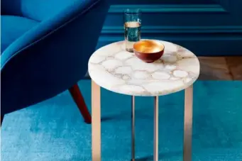  ??  ?? Brass and agate side table: Pieces of agate are fused together into a plastic laminate for this pretty side table with a base in polished brass. Each one is different. It costs £249 from West Elm