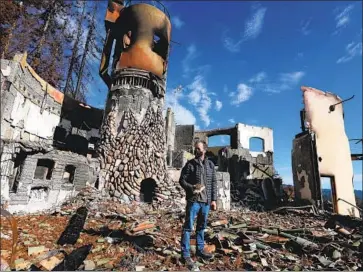  ?? Luis Sinco Los Angeles Times ?? BRADLEY BROWN, owner of Big Basin Vineyards, stands in the rubble of his home that was destroyed in a wildfire this summer. He’s unsure if he’s going to rebuild the house, but he’s not giving up on the winery.