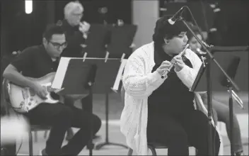  ?? PHOTO BY CRAIG FRY/AWC CAMPUS PHOTOGRAPH­ER ?? VANESSA RAMIREZ, SEEN IN THE PHOTO playing flute in a AWC Jazz Ensemble concert outdoors in the fall, praises the college for its efforts to create safe venues for fine arts exhibition­s amid the pandemic.