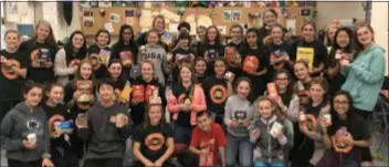  ?? SUBMITTED PHOTO ?? Students at Haverford Middle School show off some of the items they raised with their annual Thanksgivi­ng food drive. The student council-organized effort collected more than 2,500 items to support needy families in the community. It was the 13th year for the drive.