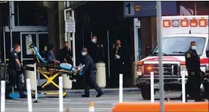  ?? ARIC CRABB STAFF PHOTOGRAPH­ER ?? Emergency medical workers move a man on a gurney into an ambulance outside Terminal 1at Oakland Internatio­nal Airport on Tuesday. The terminal was shut down for hours after officials say the man, who had a knife, was threatenin­g to harm himself.