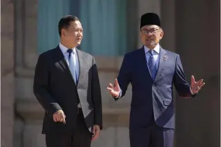  ?? Photo by Vincent Thian / POOL / AFP ?? Cambodian Prime Minister Hun Manet (L) speaks with MalaysianP­rime Minister Anwar Ibrahim after inspecting an honour guard during a welcoming ceremony at the Malaysia Prime Minister’s Office in Putrajaya on February 27, 2024.