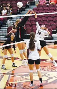  ?? Westside Eagle Observer/RANDY MOLL ?? Gentry’s Brynn Cordeiro tips the ball over the hands of Gravette’s Drew Madison during play between the two teams in Gentry on Sept. 6.