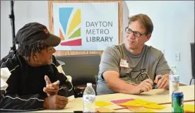  ?? CONTRIBUTE­D ?? Dayton City Commission­er Darryl Fairchild (right) shares ideas with a fellow participan­t at the Your Voice Ohio session conducted last month at the Dayton Metro Library Main Branch.