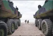  ?? Nelvin C. Cepeda San Diego Union-Tribune ?? MARINES at Camp Pendleton take a break during training with the Amphibious Combat Vehicle.