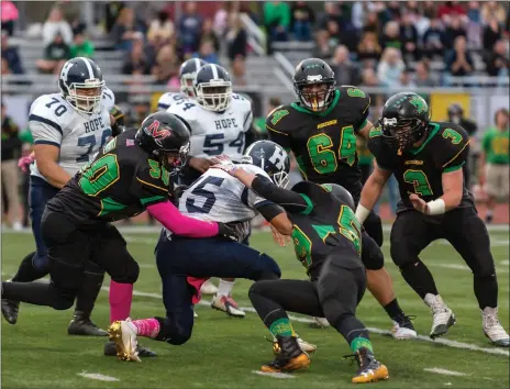  ?? File photo by Michelle Menard ?? North Smithfield senior Aldrec Viera Dones (64) wanted to play football for 10 years, but his parents wouldn’t let him because of the potential for injury. They finally let him this season and all he did was help the Northmen-Mounties win their first Super Bowl title.