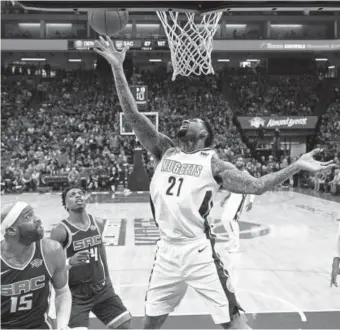  ?? Rich Pedroncell­i, The Associated Press ?? Nuggets forward Wilson Chandler tries to score Saturday night against the Kings’ Vince Carter, left, and Buddy Hield in Sacramento, Calif. Chandler finished with seven points, six rebounds and five turnovers.