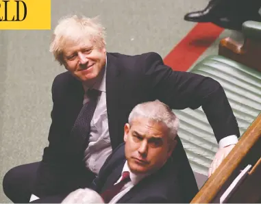  ?? JESSICA TAYLOR/U.K. PARLIAMENT/AFP VIA GETTY IMAGES ?? British Prime Minister Boris Johnson smiles during second reading of the European Union (Withdrawal Agreement)
“Brexit” Bill in the House of Commons Friday. The bill passed, paving the way for a late January withdrawal.