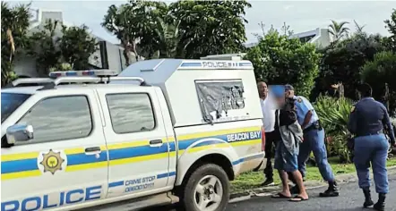  ?? Picture: SUPPLIED ?? IN CUSTODY: A male suspect was arrested Wednesday morning after allegedly threatenin­g Beacon Bay residents with the aim of extorting money.