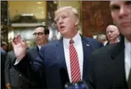  ?? PABLO MARTINEZ MONSIVAIS - THE ASSOCIATED PRESS ?? President Donald Trump gestures as he answers reporters’ questions in the lobby of Trump Tower, Tuesday, in New York.