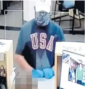  ?? TRIBUNE NEWS SERVICE ?? A man robs a U.S. Bank in Irvine, Calif., using a note that read: “Please. Stay Cool! No harm. Thx.”
