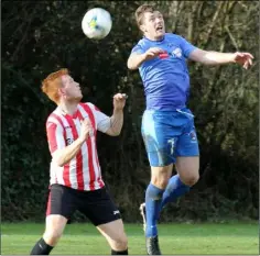  ??  ?? Aaron Collier of Bunclody and Kyle Dempsey of North End United battle for the ball in the air.