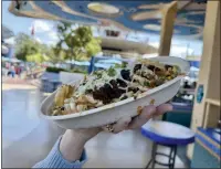  ?? BRADY MACDONALD — STAFF ?? Ferrixian Fries ($13.49) are basically chorizo-loaded waffle nachos.