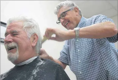  ?? GUARDIAN PHOTO BY JIM DAY ?? Ray MacRae of Charlottet­own says his long-time barber George Neale is amazing for having plied his trade for 55 years. “That’s quite an accomplish­ment,” says MacRae.