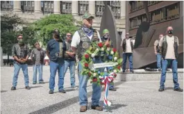  ?? ANTHONY VAZQUEZ/SUN-TIMES ?? Veterans stand during a wreath-laying ceremony at Daley Plaza on Sunday to commemorat­e sacrifices in the Persian Gulf War.