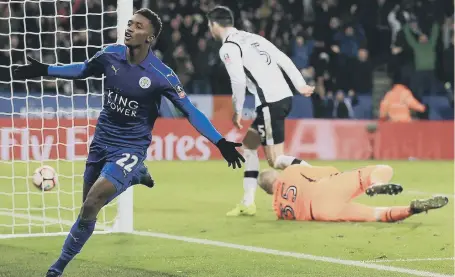  ??  ?? Demarai Gray celebrates hitting Leicester City’s clinching third goal against near-neighbours Derby last night