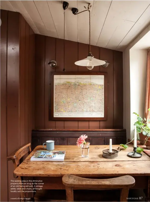  ??  ?? The seating area in this diminutive property feels as snug as the corner of an old-fashioned pub. A vintage settle, table and chairs, all bought locally, suit the proportion­s