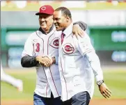  ?? DAVID JABLONSKI / STAFF ?? Davey Concepcion (left) and Barry Larkin are the greatest shortstops in Reds history, but only Larkin is in the Hall of Fame. They appear together here after throwing out ceremonial first pitches.