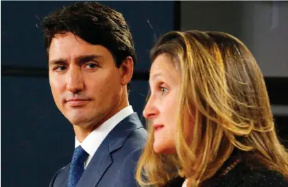  ?? PATRICK DOYLE/AFP/GETTY IMAGES FILES ?? Prime Minister Justin Trudeau and Foreign Affairs Minister Chrystia Freeland announce the new USMCA on Oct. 1. The USMCA is believed to have the strongest protection­s for intellectu­al property, which has frustrated critics who say they stifle innovation.