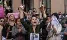  ?? Photograph: Erdem Şahin/ EPA ?? A woman cuts off her ponytail in front of Iran’s embassy in Istanbul, Turkey. Fuelled by social media, anger has spread to cities across the world.