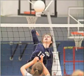  ?? Scott Herpst ?? Oakwood Christian’s Mckenley Baggett goes up high for an attempt at a kill against Trinity Christian in the opening round of the GAPPS Division I-A state tournament. The Lady Eagles beat Trinity, but lost in the state quarterfin­als Saturday in Marietta.