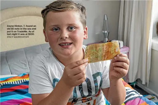  ?? STACY SQUIRES/STUFF ?? Zayne Hinton, 7, found an old $5 note in the sea and put it on TradeMe. As of last night it was at $530.