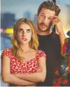  ?? NETFLIX ?? Emma Roberts, left, and Luke Bracey spend the holidays as platonic friends in Holidate.