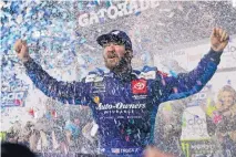  ?? STEVE HELBER/ASSOCIATED PRESS ?? Martin Truex Jr. celebrates after winning last week’s race at Martinsvil­le Speedway. He led all but 36 of the 500 laps on NASCAR’s shortest Cup track.