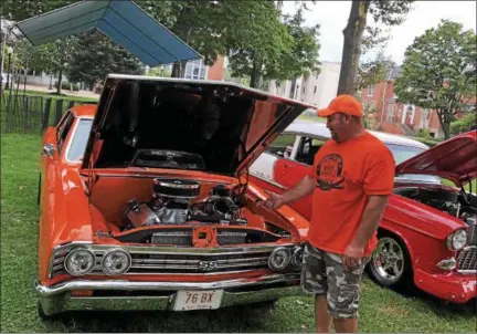  ?? TAWANA ROBERTS – THE NEWS-HERALD ?? Todd Leonard, 47, of Leroy Township, showcases a 1967 Chevrolet Chevelle at the Painesvill­e Car Cruise on Aug. 10.