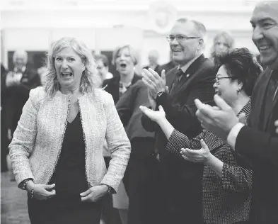  ?? SEAN KILPATRICK/THE CANADIAN PRES ?? New Conservati­ve MP Leona Alleslev is welcomed at the party’s caucus meeting on Parliament Hill on Wednesday after the Toronto-area MP crossed the floor from the ruling Liberals.