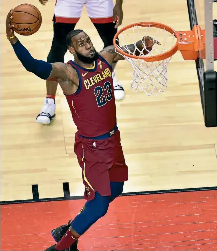  ?? AP ?? LeBron James, in his usual Cavalier fashion, dunks another basket against the Toronto Raptors in game one of their Eastern Conference semifinal.