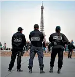  ?? GETTY IMAGES ?? Police officers have been patrolling the Place du Trocadero in front of the Eiffel Tower since the Paris attack.