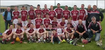  ??  ?? The St. Martin’s squad and mentors after Friday’s league final victory in Hollymount.