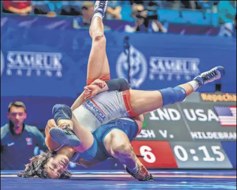  ?? PTI ?? Vinesh Phogat upset world No 1 wrestler Sarah Ann Hildebrand­t and then beat Maria Prevolarak­i of Greece to win bronze at Worlds.